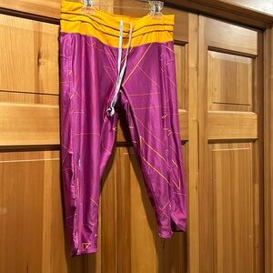 Nike dry fit with adjustable capri pant string and zipper pocket in back